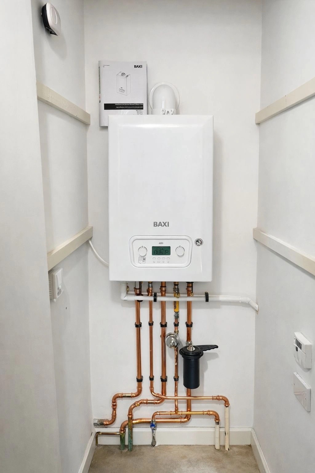 A neatly installed Baxi combi boiler with clean copper pipework, fitted by AJGas Ltd in Milton Keynes
